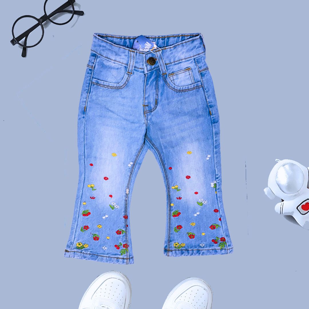 Light blue denim jeans with embroidery of flowers on bottom for girls